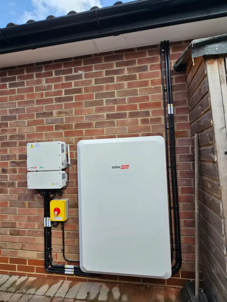 Battery and inverter on an outside brick wall