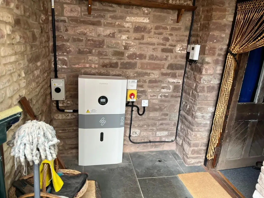 Battery storage unit installed on a brick wall