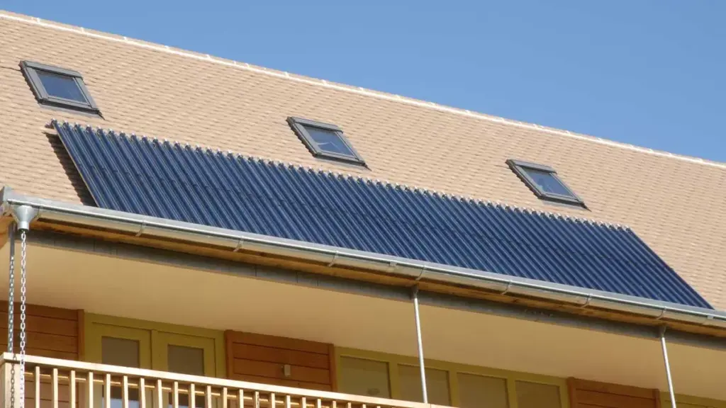 Solar thermal collector tubes along a pitched roof