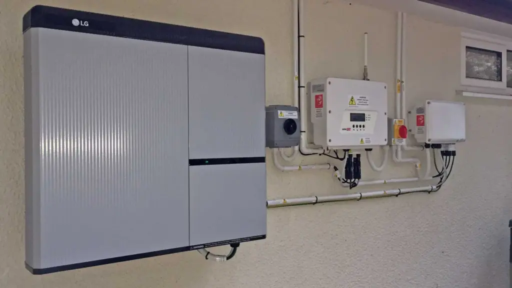 Wall-mounted home battery with isolator switches
